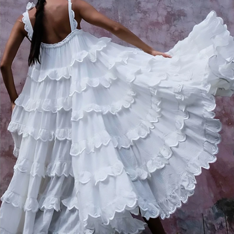 Romantic bohemian ruffle dress in white lace.
